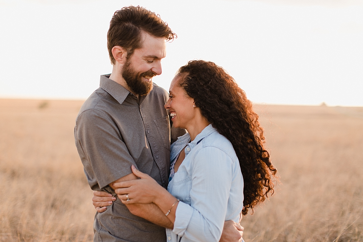 photo of couple in a grassy field